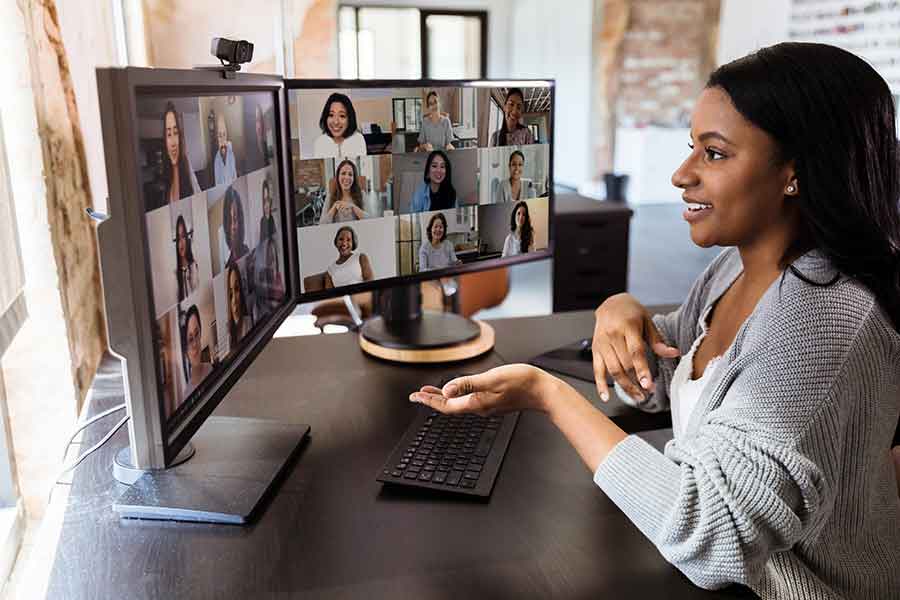 Woman on video teleconference for work from home office.